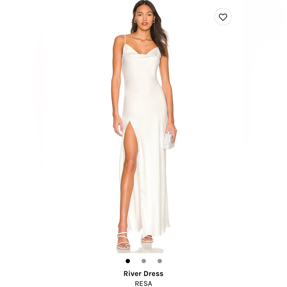 Long, white cowl-neck tie-back dress with slit